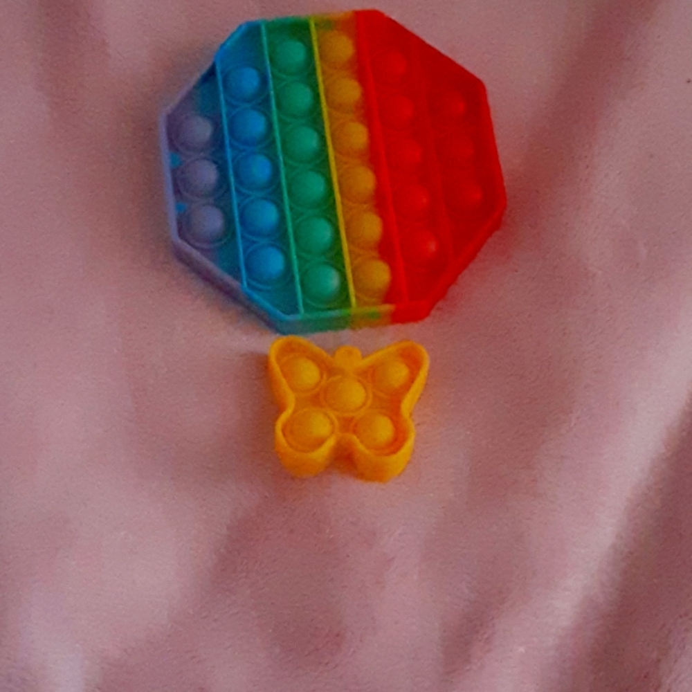 Yellow butterfly mini pop it and rainbow octagon pop it